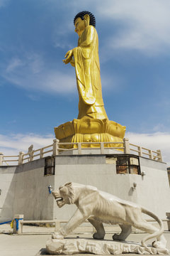 Golden statue of young Buddha near the hill Zaisan in Ulaanbator