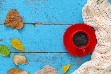 Autumn background with dry leaves and cup of coffee