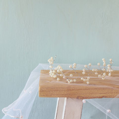 image of pearls tiara on toilet table