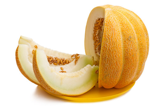 Slices of ripe melon on a yellow plate