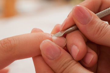 Manicure treatment, removing excess cuticles