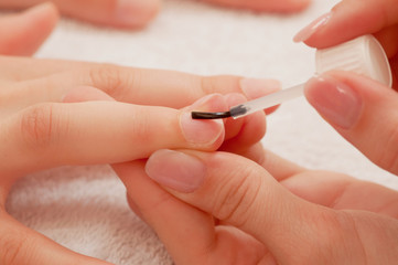 Manicure treatment, applying base coat
