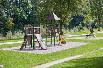 Obraz premium Childrens playground equipment in the green park