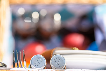 Salt And Pepper With Cutlery In Picnic Basket