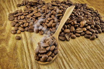 Coffee beans on vintage wooden board