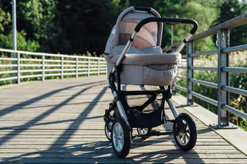 Baby stroller on running path in park