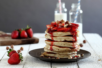 pancakes with strawberries on a white background