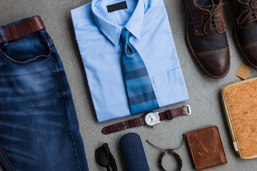 Men's fashion, casual outfits with accessories, flat lay, top view on gray grunge flat lay...