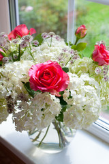 beautiful bouquet of flowers on window sill