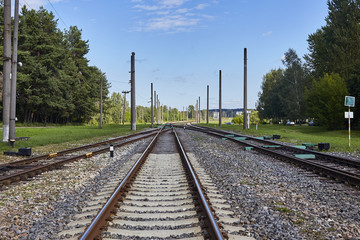 Obraz premium Railway or railroad tracks for train transportation under blue sky
