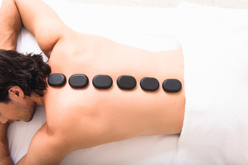 Relaxed man lying at spa