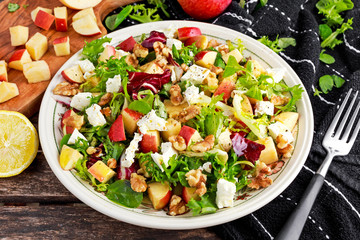 Light Fresh Home made fruit apple salad with walnuts, vegetables, feta cheese