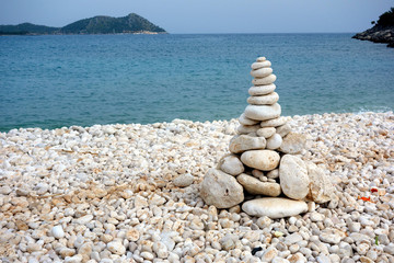 Cairns on a lonely beach, Likya Yolu Hiking Trail, Turkey