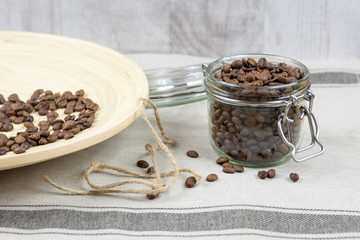 Coffee beans in a glass jar. Top view.