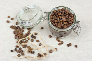 Coffee beans in a glass jar. Top view.
