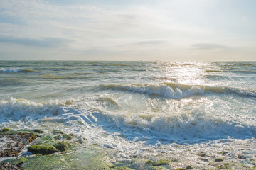 Sunset over a stormy sea in summer