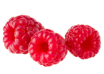 ripe raspberries isolated on white background close up