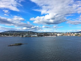 Obraz premium Oslo, the capital of Norway. Photo taken from the fjord in northern direction. Areas on this picture: Tjuvholmen, Aker Brygge and Oslo city hall.
