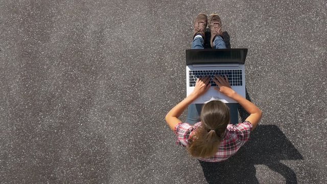 Woman with a laptop and free space on the left