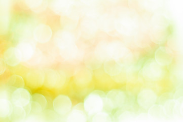 Fototapeta premium Niewyraźne żółte tło z bokeh świateł