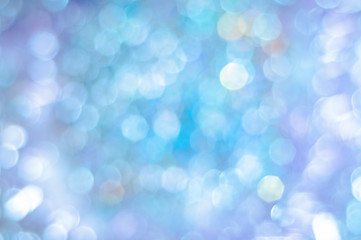 Blurred blue background with bokeh lights