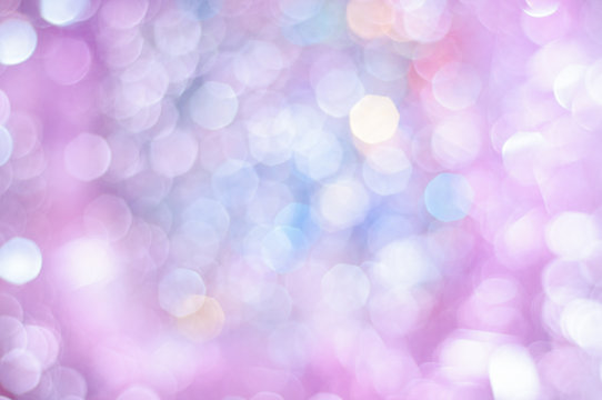 Blurred pale lilac and blue background with bokeh lights