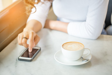 woman use smart phone in coffee time