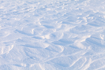 snow texture on the lake on a sunny day