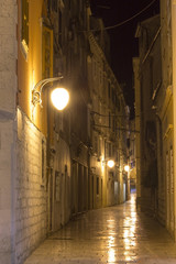 Fototapeta na wymiar Empty alley in old town Sibenik at night