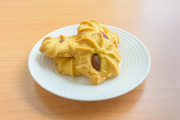 Biscuits almonds on wooden table
