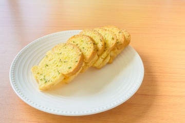 Garlic bread on wooden table