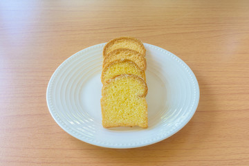 Butter bread on wooden table