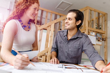 Two young architects in office