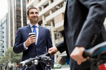 Young businessmen with a bike