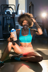 Fototapeta na wymiar portrait of attractive afro woman enjoying time at aerobic class