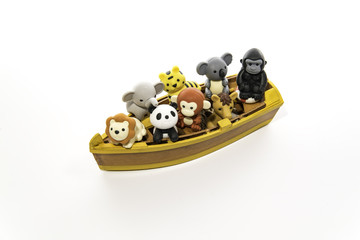 Fototapeta premium Group of animals in the small yellow boat