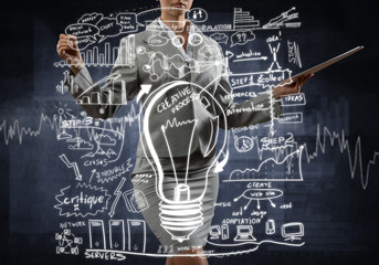 Woman sketching business ideas 