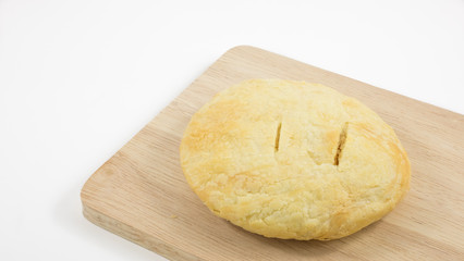 The Taiwanese sun cake (milk butter pastry) on the brown wooden plank.