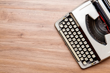 old typewriter on wooden ground