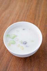 Fototapeta na wymiar Rice flour ball in sweet coconut milk with coconut , Bua Loi Thai dessert