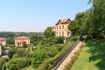 Fototapeta na wymiar Houses at historic industrial town Crespi d'Adda near Bergamo, Lombardy, Italy