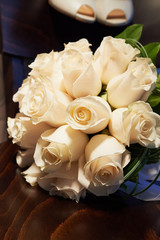 Wedding bouquet a classic round shape from a large cream roses. wedding floristry