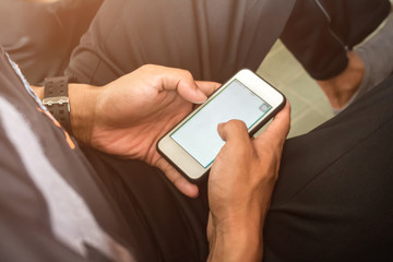 Man using smartphone for play game or online social network