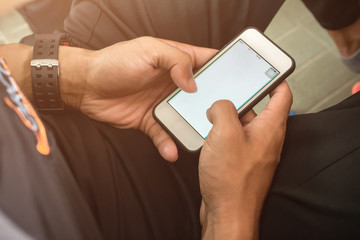 Man using smartphone for play game or online social network