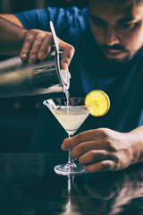 Barman making margarita cocktail