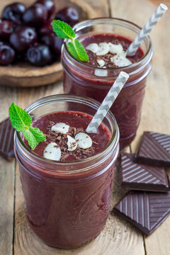 Black forest smoothie with cherry, almond milk and cacao, vertical