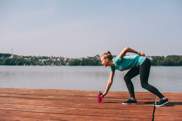 She performs exercises on pier