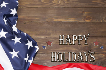 Happy holiday. American flag, text on a wooden background. The view from the top, a place for advertising.