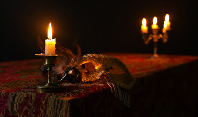  candlestick and Venetian mask