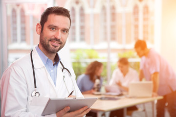 Portrait of a young attractive doctor at the hospital